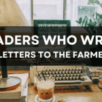 Desk with a vintage typewriter, iced coffee, books, and a lamp in front of a window with plants. Text overlay reads “Readers Who Write – Letters to the Editor.” Logo in the corner says “The Founding Farmers, Transparency at Home.”